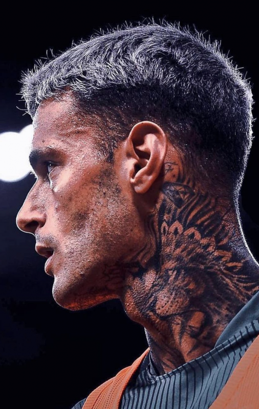 PSG's Gregory van der Wiel sports a tattoo in his neck as he