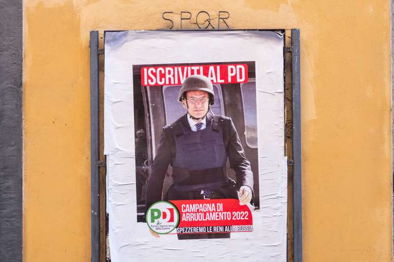 roma, manifesto fake di enrico letta in elmetto e giubbotto antiproiettile