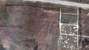 foto satellitari della fossa comune a manhush.